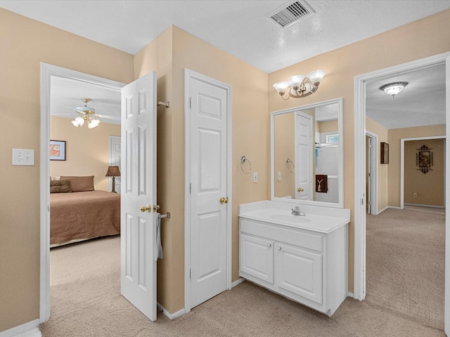 bathroom featuring visible vents, ensuite bathroom, carpet, a chandelier, and vanity