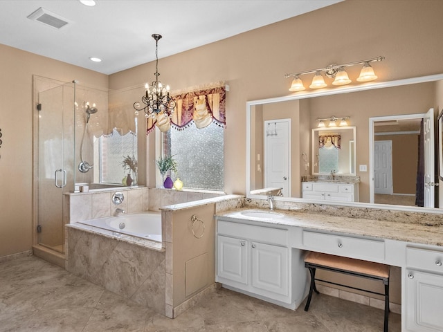 bathroom with visible vents, a shower stall, a chandelier, a garden tub, and vanity