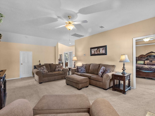 carpeted living room featuring a ceiling fan and visible vents