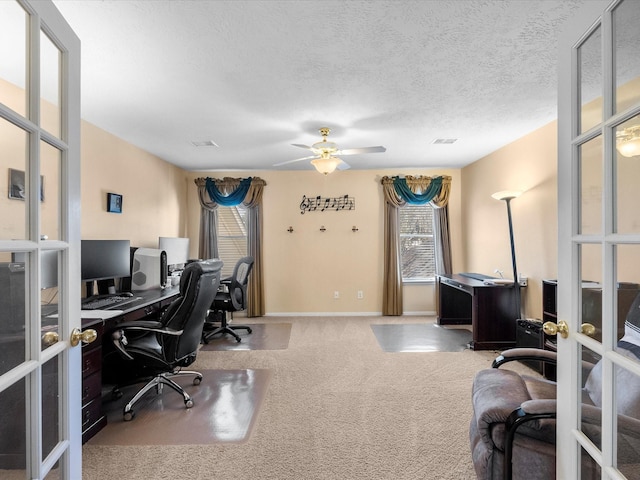 office space featuring visible vents, carpet floors, french doors, a textured ceiling, and a ceiling fan