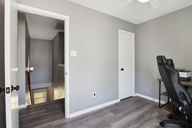 office space with visible vents, a ceiling fan, baseboards, and wood finished floors