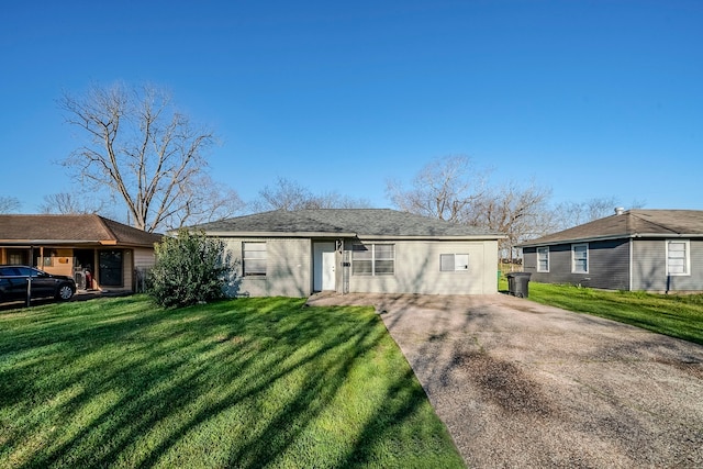 single story home with a front yard and driveway