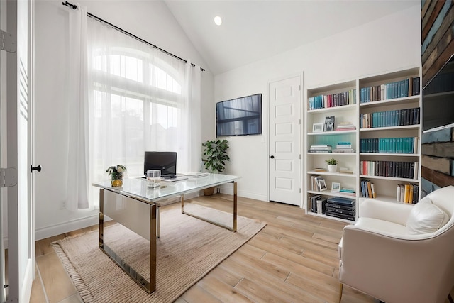 office featuring recessed lighting, light wood-type flooring, lofted ceiling, and baseboards