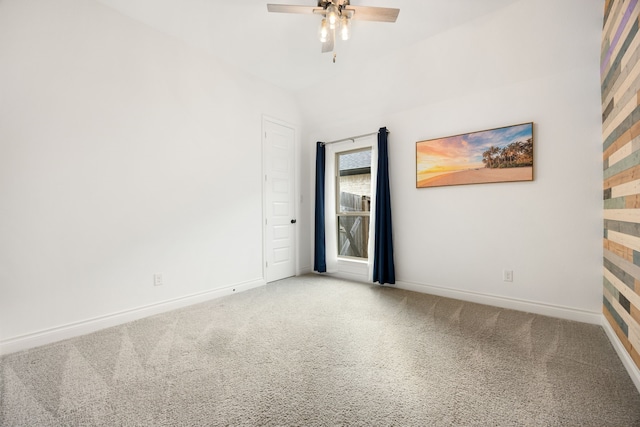 unfurnished room featuring carpet flooring, a ceiling fan, and baseboards