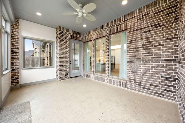 interior space with ceiling fan