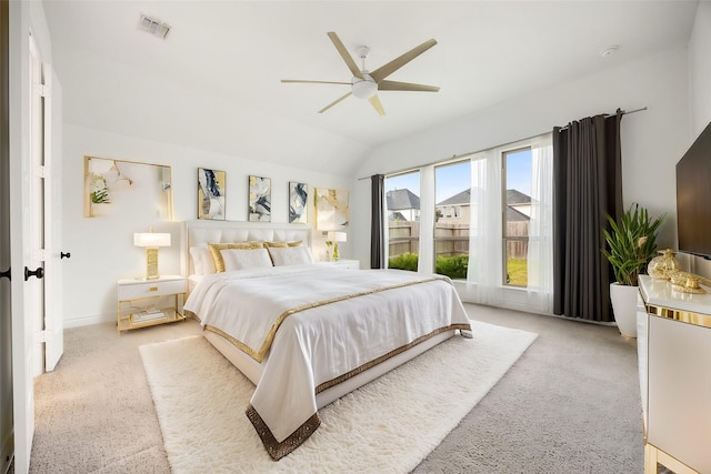 bedroom with lofted ceiling, carpet, visible vents, and ceiling fan