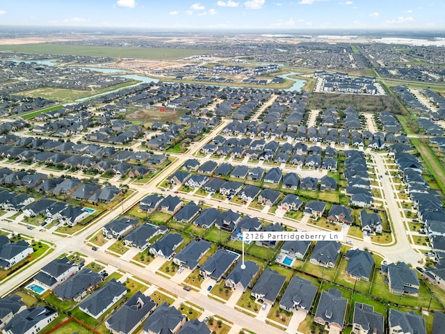 birds eye view of property with a residential view