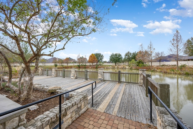 view of dock featuring a deck with water view