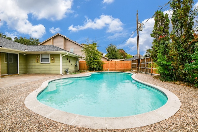 view of swimming pool featuring a patio area, a fenced in pool, and a fenced backyard