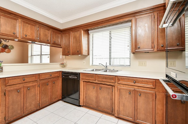 kitchen featuring brown cabinetry, dishwasher, and a sink