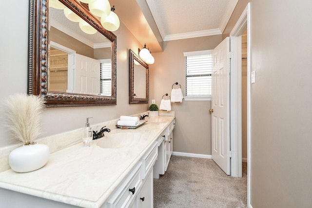 bathroom with vanity, crown molding, baseboards, and a textured ceiling