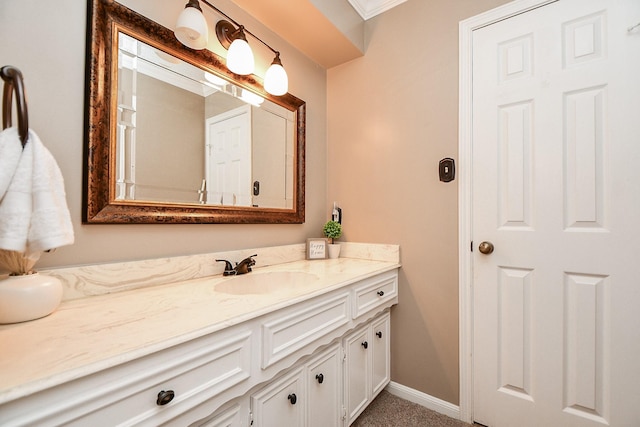 bathroom featuring baseboards and vanity