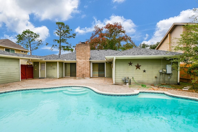 outdoor pool featuring a patio and fence