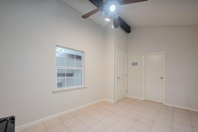 spare room with light tile patterned floors, baseboards, visible vents, beam ceiling, and ceiling fan