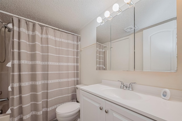 bathroom with a textured ceiling, vanity, a shower with curtain, toilet, and visible vents