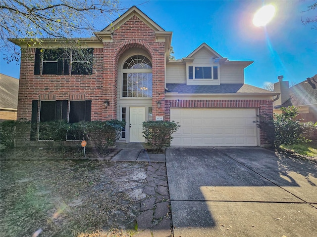 traditional home with brick siding, concrete driveway, an attached garage, and a shingled roof