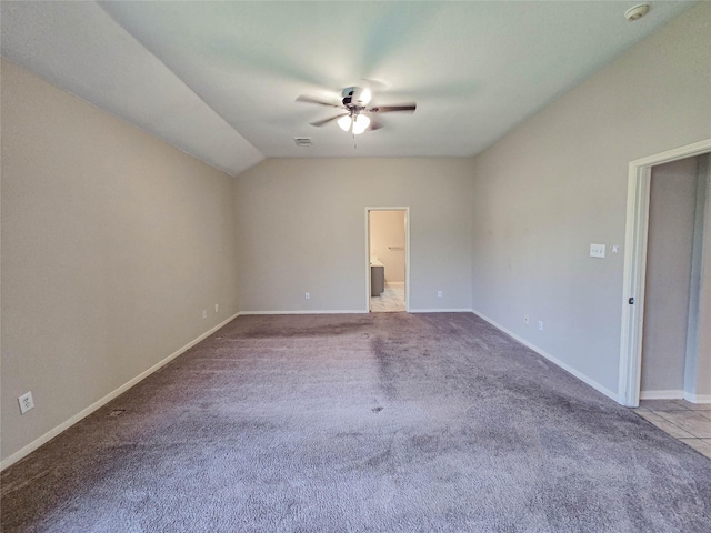 carpeted empty room featuring visible vents, baseboards, and a ceiling fan