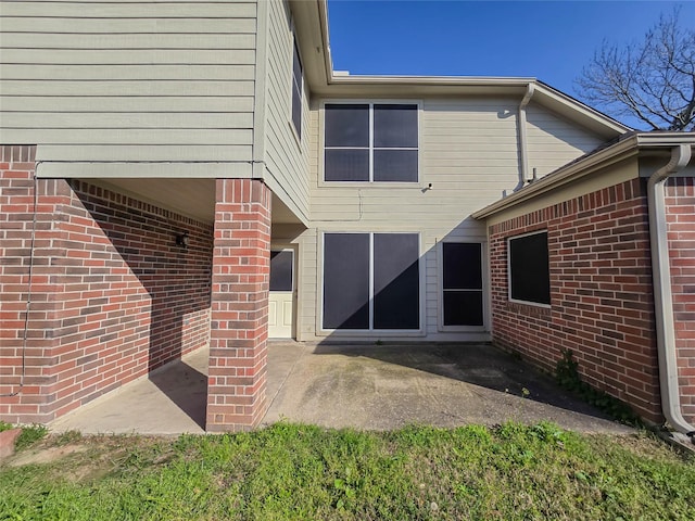 back of property with a patio area