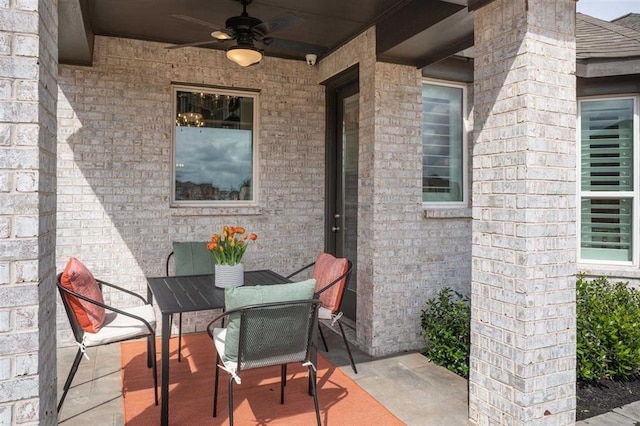 view of patio featuring outdoor dining space and ceiling fan