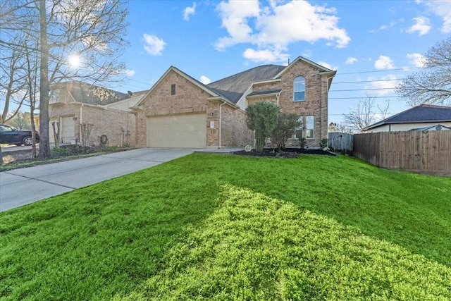 traditional home featuring a front yard, fence, brick siding, and driveway