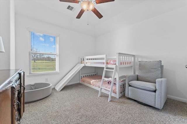 bedroom with visible vents, carpet floors, baseboards, and a ceiling fan