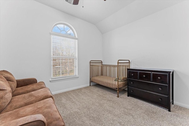 bedroom featuring carpet floors, ceiling fan, baseboards, and vaulted ceiling