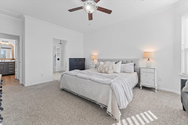 bedroom featuring baseboards, ensuite bathroom, carpet, and ornamental molding