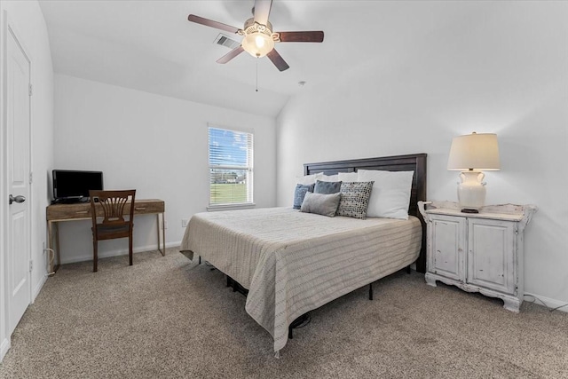 bedroom with visible vents, lofted ceiling, light colored carpet, and baseboards