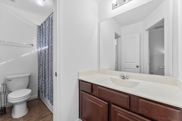 full bathroom featuring visible vents, toilet, tile patterned flooring, baseboards, and vanity