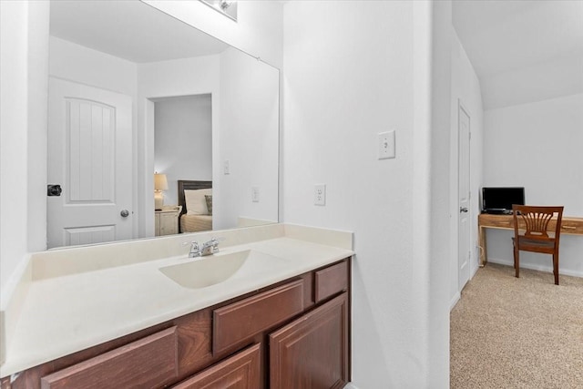 bathroom with baseboards and vanity