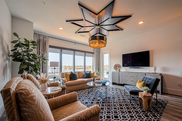 living room with visible vents, recessed lighting, wood finished floors, and baseboards