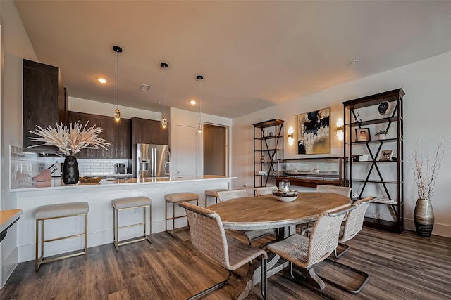 dining room featuring recessed lighting and dark wood-style floors