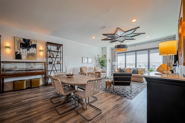 dining room with recessed lighting, wood finished floors, and visible vents