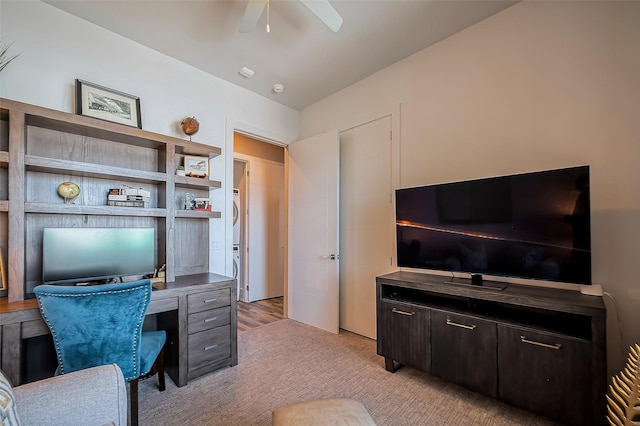 office area featuring light colored carpet and ceiling fan