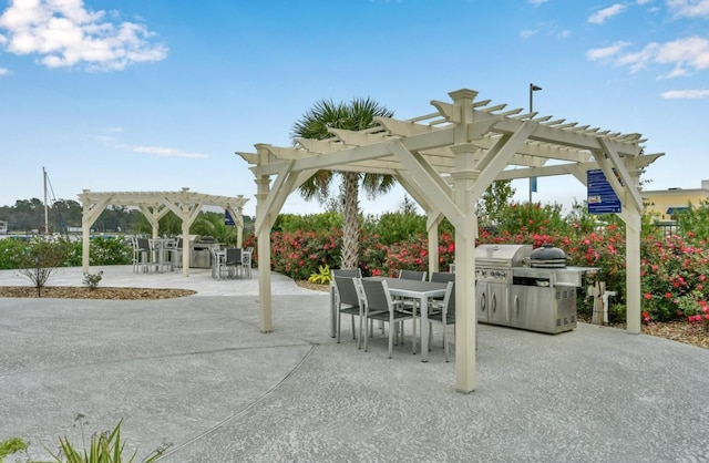 view of patio with outdoor dining space and a pergola