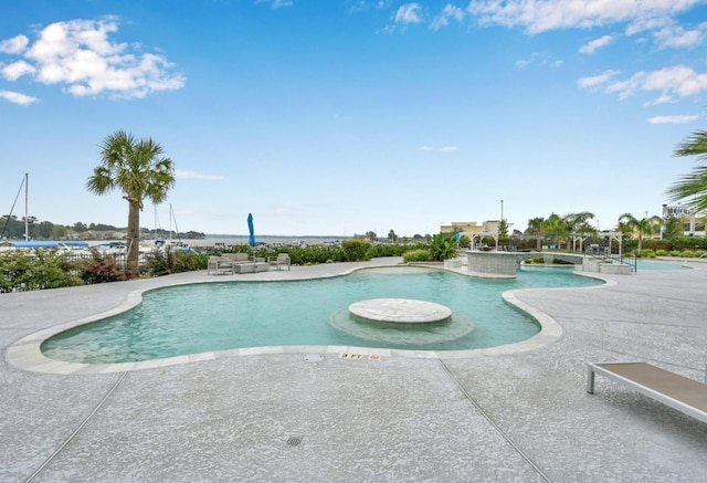 pool featuring a patio area