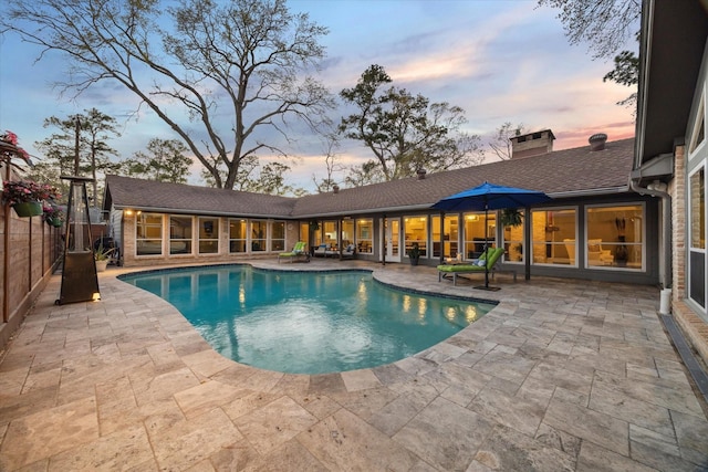 view of pool with a patio area and a fenced in pool