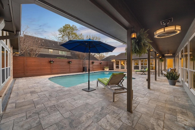 view of pool with a patio area, a fenced in pool, and a fenced backyard