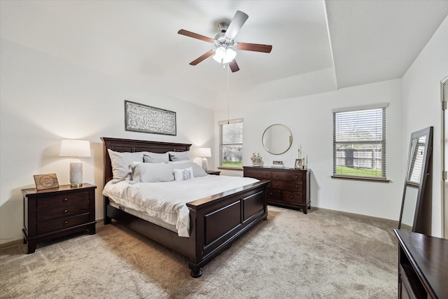 bedroom with baseboards, light colored carpet, and a ceiling fan