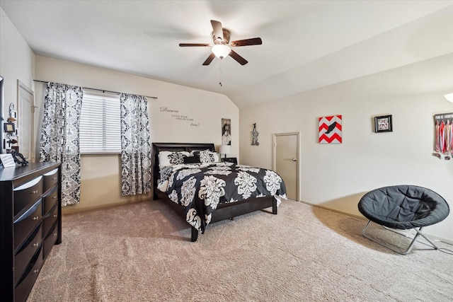 carpeted bedroom featuring ceiling fan and lofted ceiling