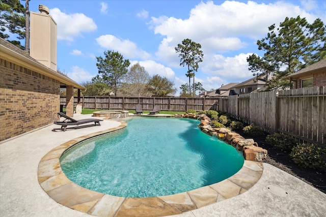 view of pool with a patio area, a fenced backyard, a fenced in pool, and an in ground hot tub