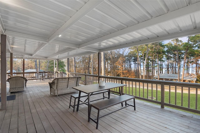 wooden terrace with a yard