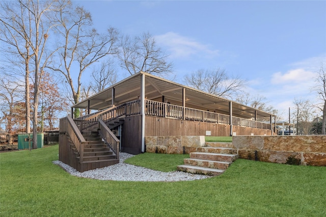 exterior space featuring stairs and a yard