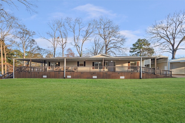 back of property featuring a yard