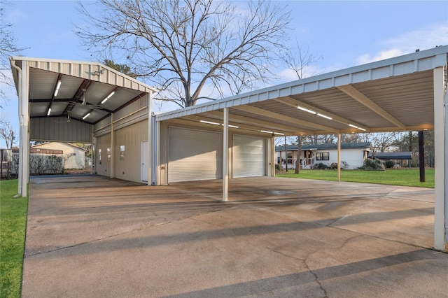 view of vehicle parking with a garage