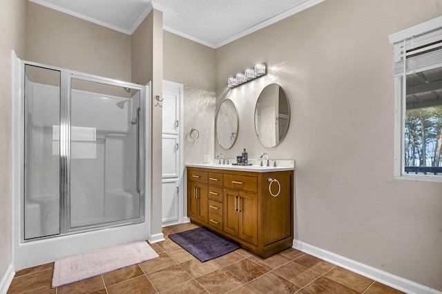 full bath featuring crown molding, baseboards, a stall shower, tile patterned floors, and vanity