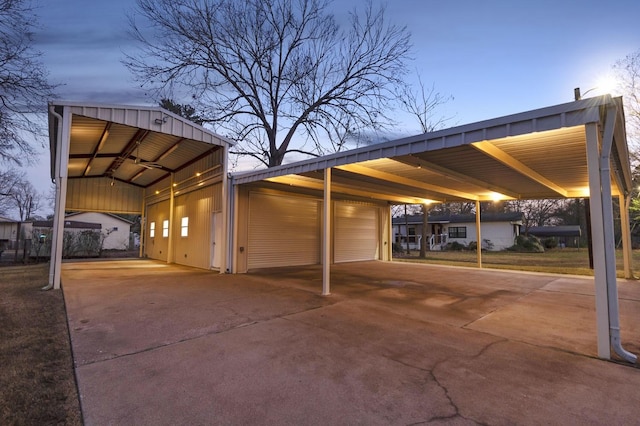 view of vehicle parking with a carport