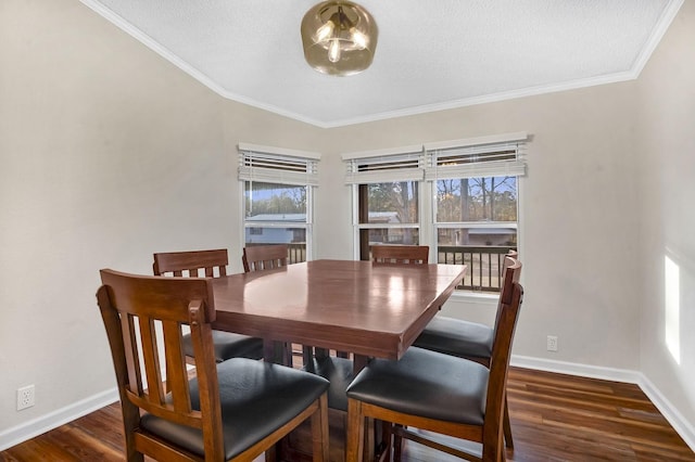 dining area with dark wood-style floors, baseboards, and ornamental molding