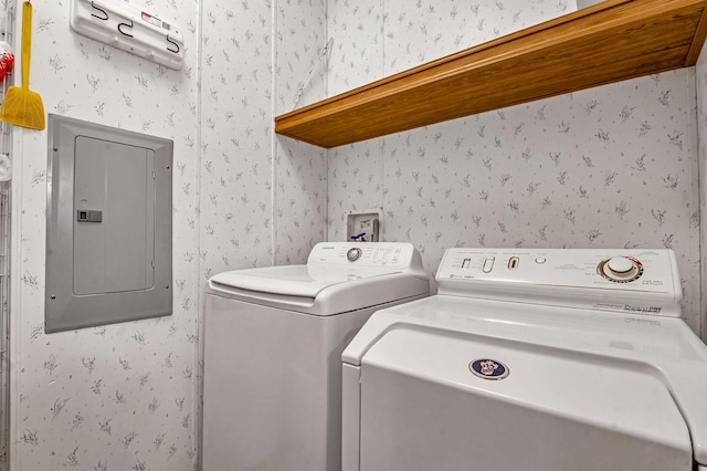 washroom featuring wallpapered walls, laundry area, electric panel, and separate washer and dryer