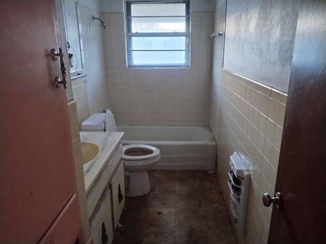 full bathroom with tile walls, shower / bathtub combination, toilet, and vanity